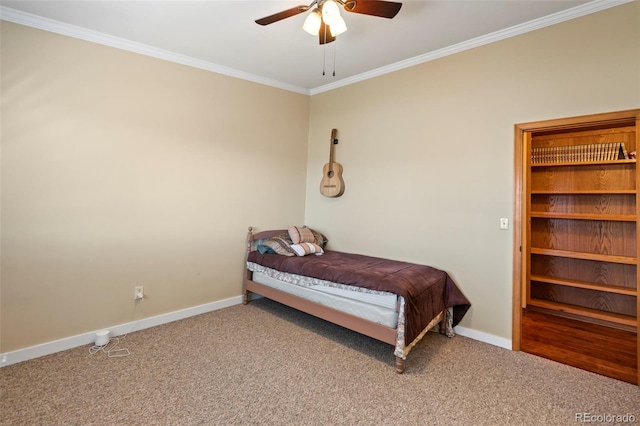 bedroom with crown molding, carpet floors, and ceiling fan