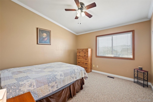 carpeted bedroom with crown molding, ceiling fan, and vaulted ceiling