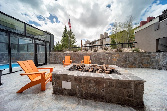 view of patio with an outdoor fire pit