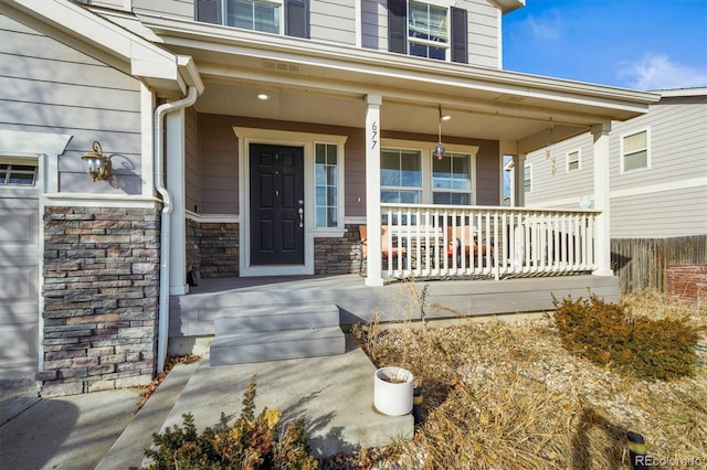 doorway to property with a porch