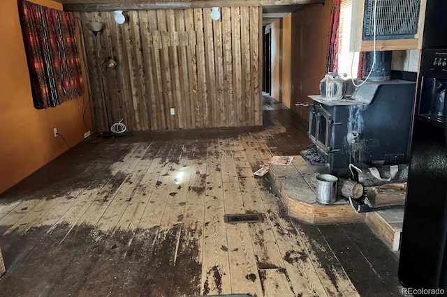 interior space featuring wooden walls and dark hardwood / wood-style floors