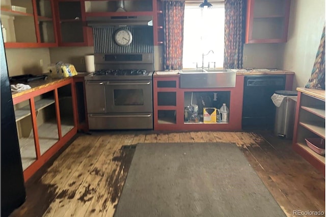 kitchen featuring gas range, dark wood-type flooring, and sink