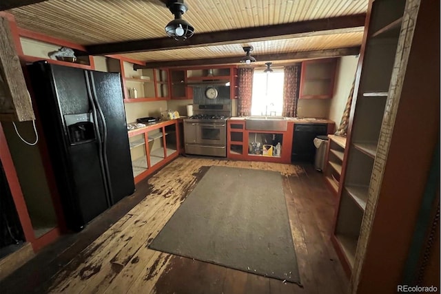 kitchen with black appliances, sink, beamed ceiling, and hardwood / wood-style flooring