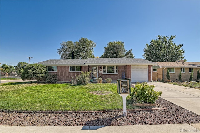 ranch-style home with a garage and a front yard