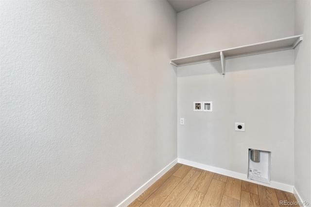 2536 Lupton Ln, Lafayette, CO 80026 - laundry area with washer hookup, light wood finished floors, baseboards, and hookup for an electric dryer