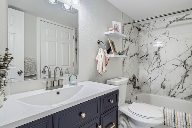 7198 Eaton Ct, Arvada, CO 80003 - full bathroom with toilet, a textured wall, vanity, and bathtub / shower combination