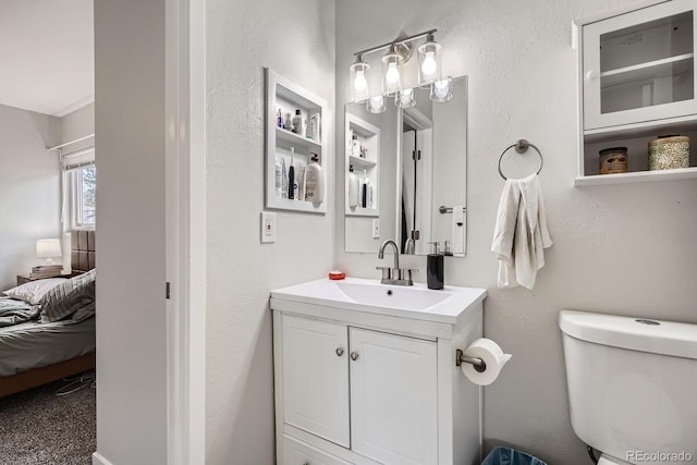7198 Eaton Ct, Arvada, CO 80003 - bathroom featuring vanity, ensuite bathroom, and toilet