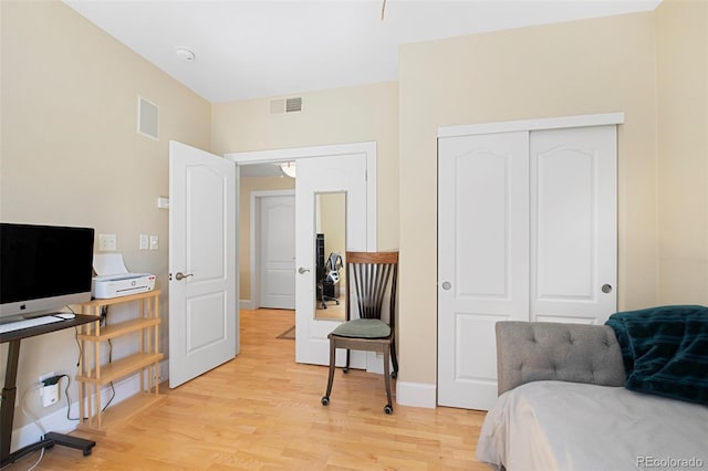 1560 Milwaukee St Unit 240, Denver, CO 80206 - bedroom with light wood-style flooring, a closet, and baseboards