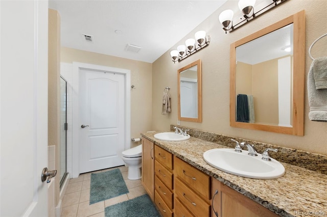 1560 Milwaukee St Unit 240, Denver, CO 80206 - full bath featuring a shower with door, tile patterned floors, double vanity, and toilet