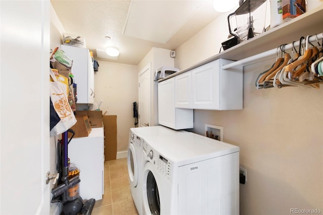 1560 Milwaukee St Unit 240, Denver, CO 80206 - laundry area with cabinet space, washing machine and dryer, and light tile patterned floors