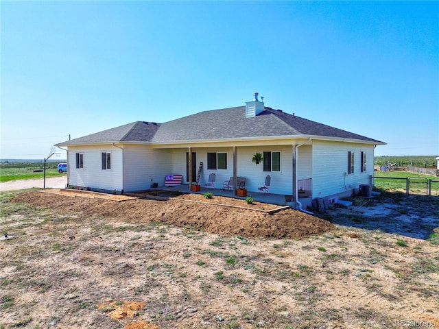 40051 Cold Iron Rd, Ramah, CO 80832 - view of front of home featuring a porch, a chimney, and a shingled roof