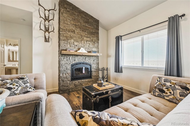40051 Cold Iron Rd, Ramah, CO 80832 - living room featuring lofted ceiling, a fireplace, baseboards, and wood finished floors