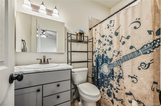 40051 Cold Iron Rd, Ramah, CO 80832 - bathroom with vanity, toilet, a ceiling fan, and curtained shower