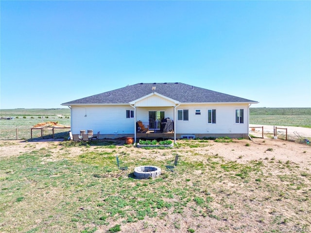 40051 Cold Iron Rd, Ramah, CO 80832 - back of house featuring an outdoor fire pit, a deck, and a rural view