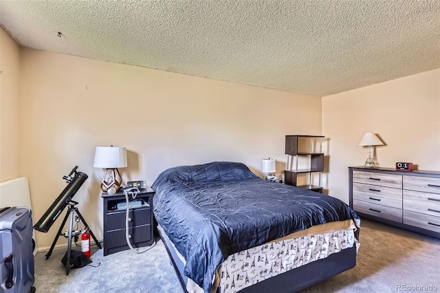 bedroom featuring a textured ceiling and carpet
