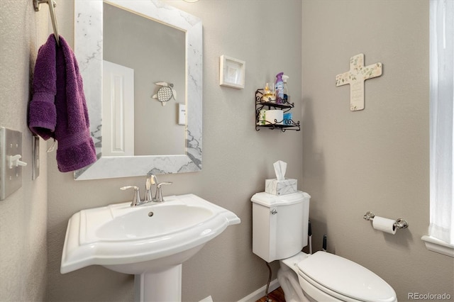 bathroom with sink and toilet