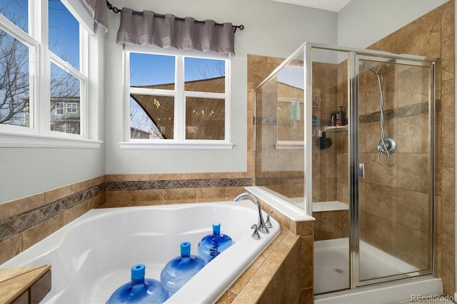 bathroom featuring separate shower and tub