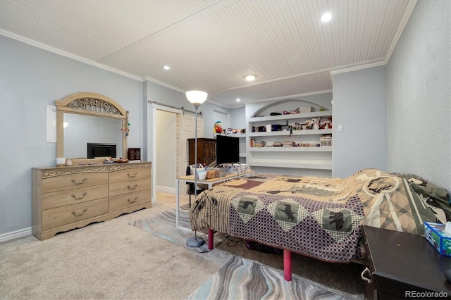 carpeted bedroom with crown molding and a barn door