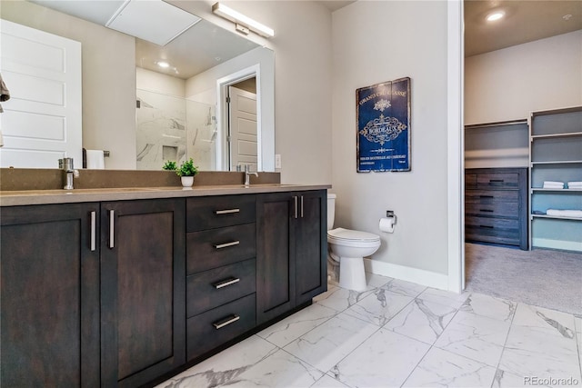 bathroom with vanity, an enclosed shower, and toilet