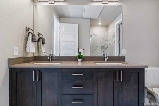 bathroom with vanity, toilet, and walk in shower