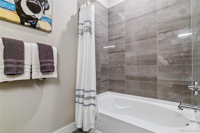 bathroom with shower / bath combo