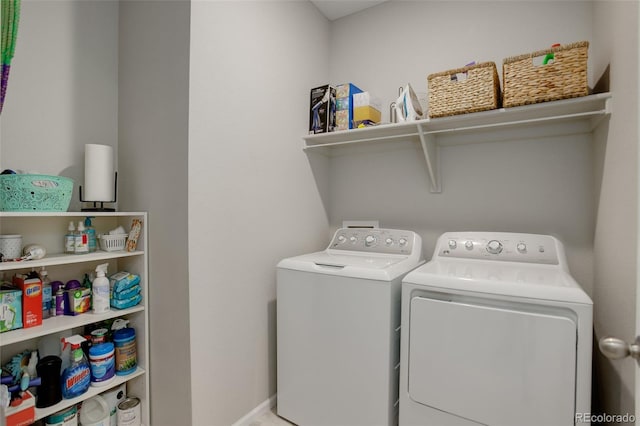 washroom with washing machine and clothes dryer