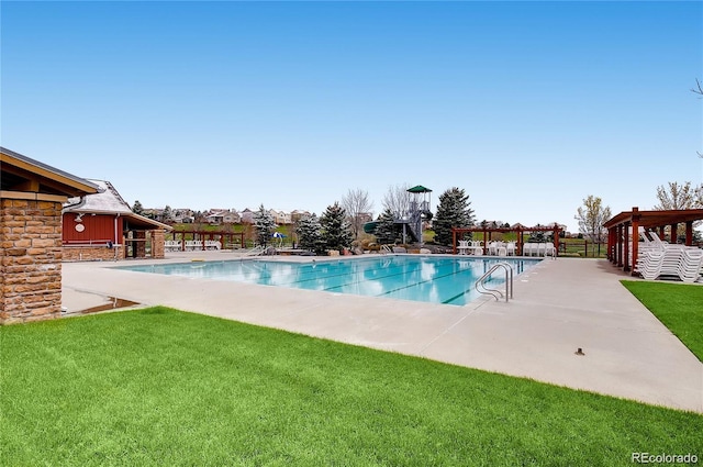 community pool featuring a yard, a patio, a gazebo, and fence