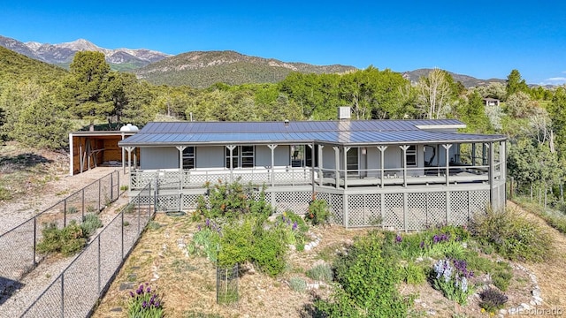 236 Boreen Way, Howard, CO 81233 - view of front facade with a porch, metal roof, a standing seam roof, and a mountain view