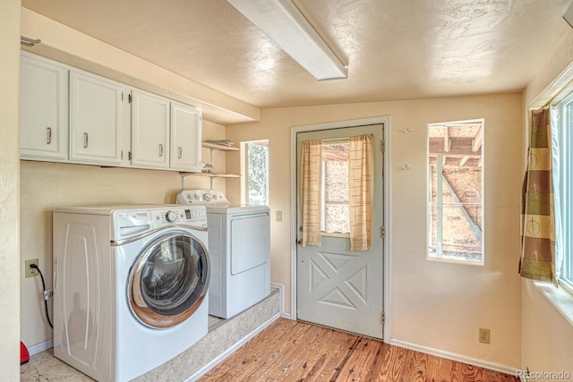 236 Boreen Way, Howard, CO 81233 - laundry room with independent washer and dryer, cabinet space, light wood-type flooring, and baseboards