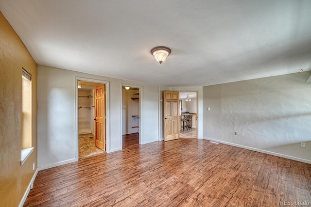 236 Boreen Way, Howard, CO 81233 - unfurnished bedroom featuring wood finished floors, baseboards, and a spacious closet