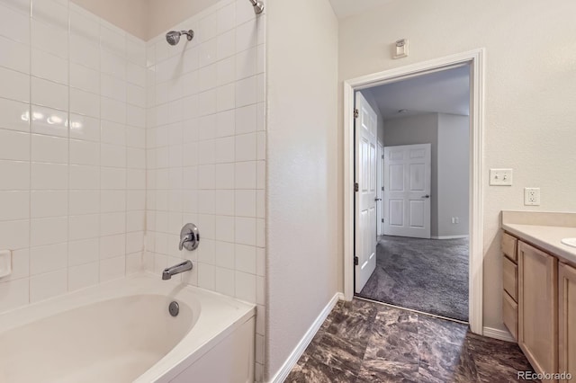 bathroom featuring shower / washtub combination, vanity, and baseboards