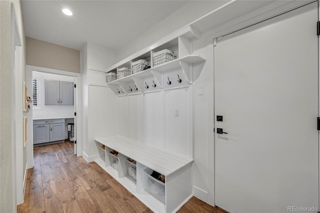 mudroom with light hardwood / wood-style floors