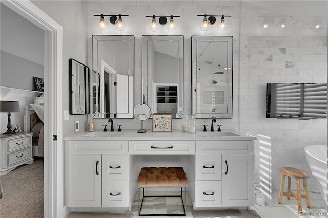 bathroom featuring vanity, vaulted ceiling, independent shower and bath, and tile walls