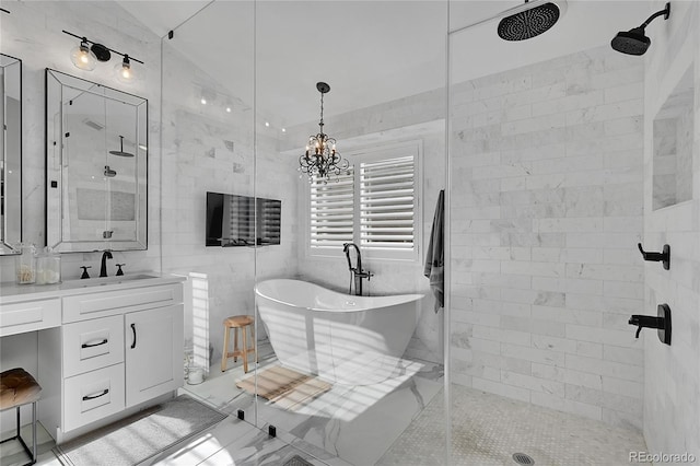 bathroom with tile walls, vanity, and separate shower and tub