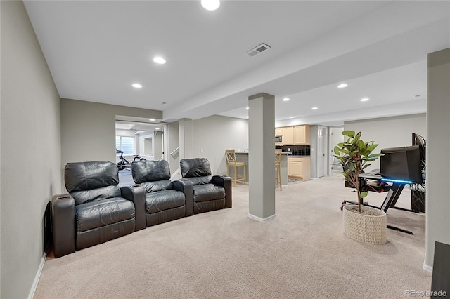 living room featuring light colored carpet, baseboards, visible vents, and recessed lighting