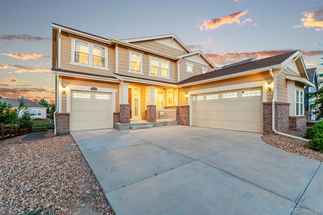 19894 W 94th Ln, Arvada, CO 80007 - view of front facade featuring brick siding, driveway, and a porch