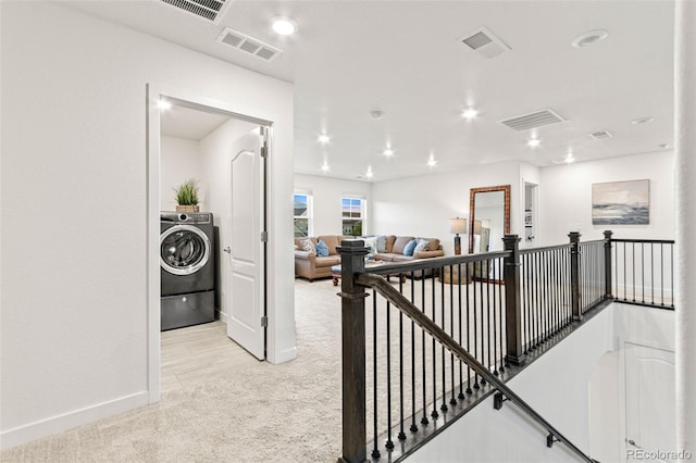 19894 W 94th Ln, Arvada, CO 80007 - hall with carpet flooring, washer / clothes dryer, an upstairs landing, and recessed lighting