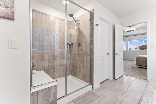 19894 W 94th Ln, Arvada, CO 80007 - ensuite bathroom featuring a shower stall and baseboards