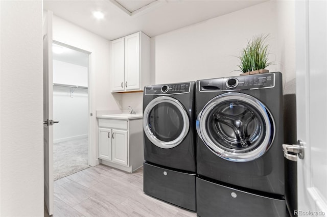 19894 W 94th Ln, Arvada, CO 80007 - washroom with washer and clothes dryer and cabinet space