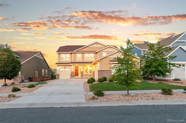 19894 W 94th Ln, Arvada, CO 80007 - craftsman inspired home with concrete driveway, an attached garage, and brick siding