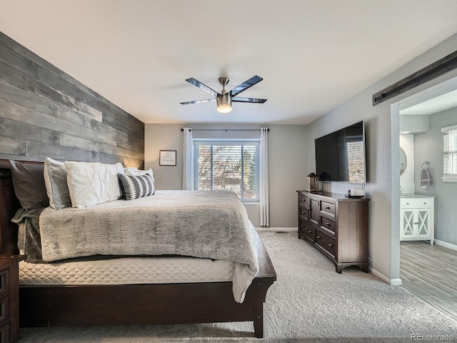 bedroom with ceiling fan and light colored carpet