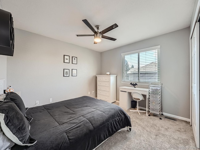 bedroom with carpet floors, a closet, and ceiling fan