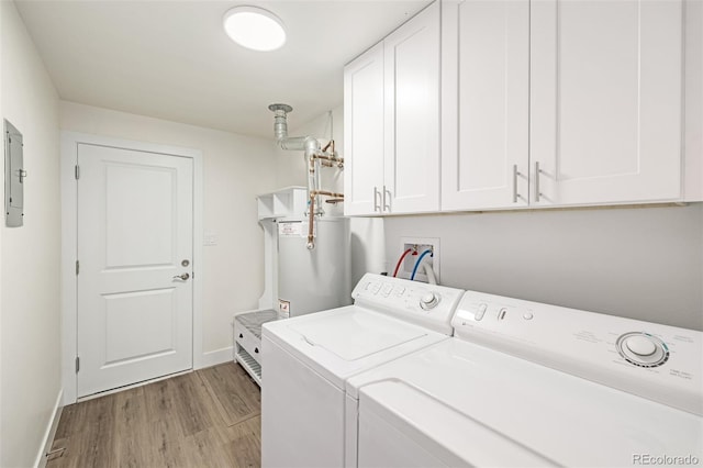 laundry area with light wood-style flooring, washer and clothes dryer, gas water heater, cabinet space, and baseboards