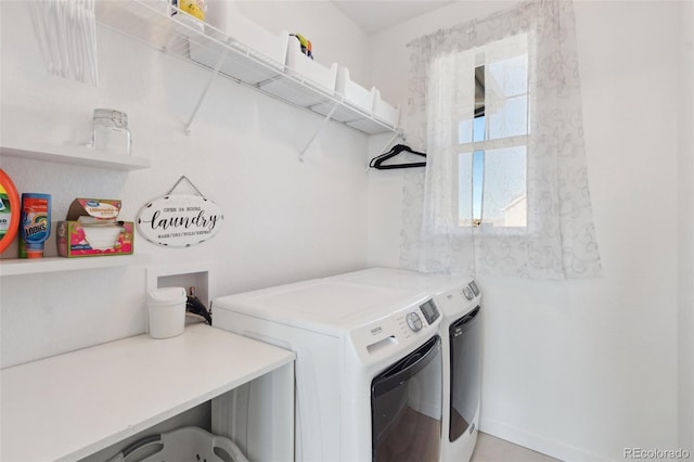 clothes washing area with independent washer and dryer