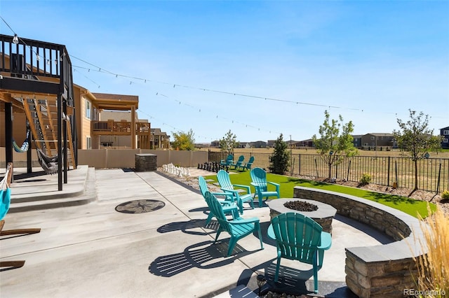 view of patio with a fire pit