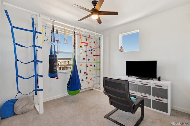 office area featuring light colored carpet and ceiling fan