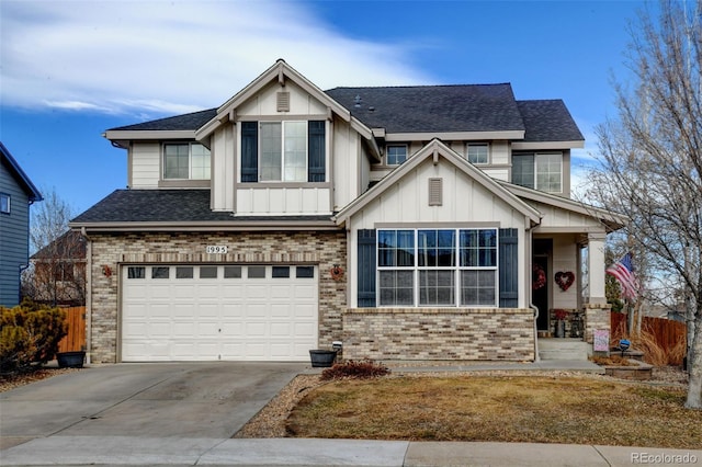 craftsman-style house featuring brick siding, concrete driveway, board and batten siding, fence, and a garage