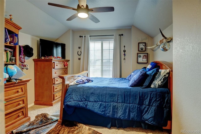 carpeted bedroom featuring ceiling fan and lofted ceiling