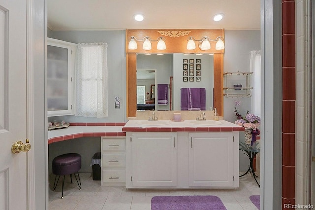 bathroom with tile patterned floors, vanity, and crown molding