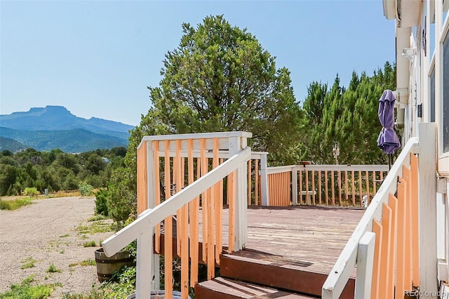 wooden terrace with a mountain view